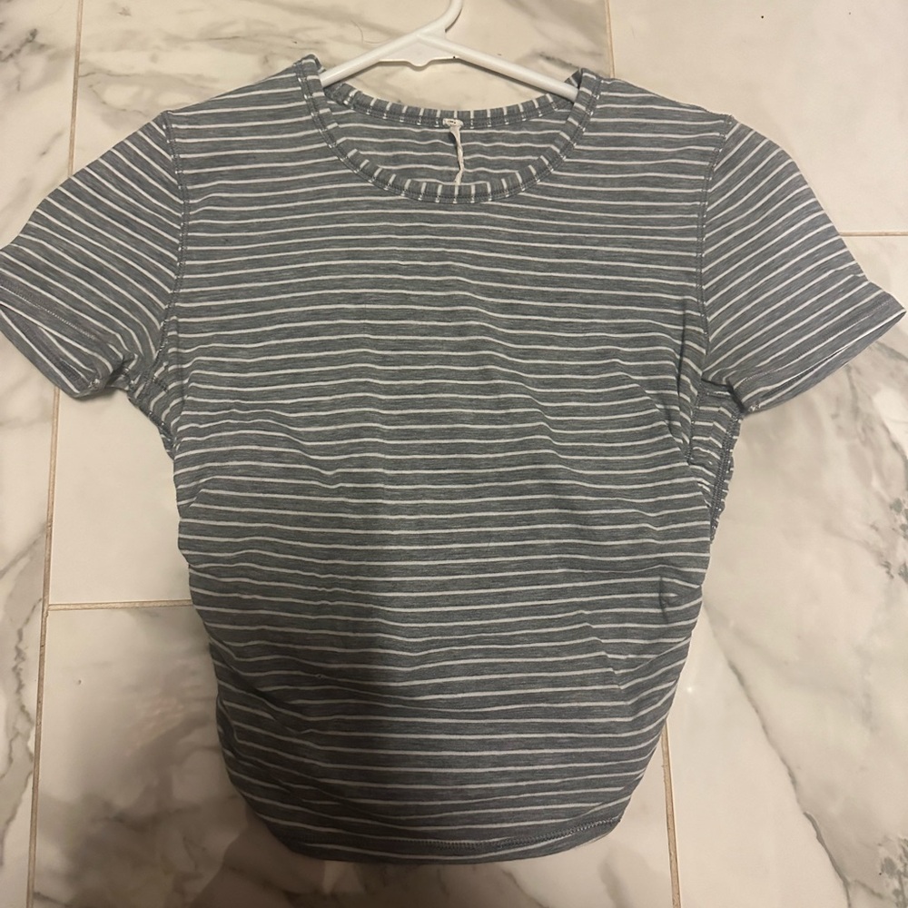 Lululemon size 2 workout tee with cinched waist. Good condition